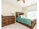 Cozy bedroom with a wood bed frame, complemented by a matching dresser and natural light at 410 Mountain Laurel, Chapel Hill, NC 27517