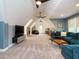 Bonus room with plush seating and a large tv, great for entertainment and relaxation at 410 Mountain Laurel, Chapel Hill, NC 27517