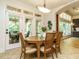 Sunny dining room with seating for four and access to outdoor patio through glass doors at 410 Mountain Laurel, Chapel Hill, NC 27517