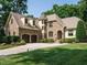 Stunning stone home with a two-car garage and manicured lawn at 410 Mountain Laurel, Chapel Hill, NC 27517
