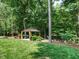 Outdoor gazebo and landscaping with comfortable seating and trees at 410 Mountain Laurel, Chapel Hill, NC 27517
