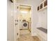 Functional laundry room with modern washer/dryer and convenient storage solutions at 410 Mountain Laurel, Chapel Hill, NC 27517