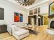 Spacious living room with fireplace, hardwood floors, and large windows at 410 Mountain Laurel, Chapel Hill, NC 27517