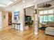 Open-concept living area with hardwood floors and large windows at 410 Mountain Laurel, Chapel Hill, NC 27517