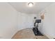 Bedroom featuring a fitness bike, modern wall decor, and neutral carpet at 44 Bordeaux Dr, Clayton, NC 27527