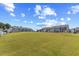 A wide lawn with a view of a nice townhouse community under a blue sky at 44 Bordeaux Dr, Clayton, NC 27527
