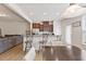 Bright kitchen and eat-in dining area with stainless steel appliances and wooden floors at 44 Bordeaux Dr, Clayton, NC 27527
