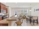 Bright kitchen features a breakfast bar, modern appliances, and a dining area with natural light at 44 Bordeaux Dr, Clayton, NC 27527