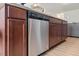 Stainless steel dishwasher with wooden cabinets and light countertops at 44 Bordeaux Dr, Clayton, NC 27527