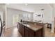 Modern kitchen with stainless steel appliances, granite countertops, and access to outdoor space at 44 Bordeaux Dr, Clayton, NC 27527