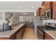 Open kitchen featuring stainless steel appliances and connecting to the living area at 44 Bordeaux Dr, Clayton, NC 27527