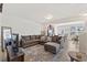 Open-concept living room with a comfortable sectional and modern decor at 44 Bordeaux Dr, Clayton, NC 27527