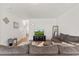 Comfortable living room with ample seating, modern decor, and an entertainment center at 44 Bordeaux Dr, Clayton, NC 27527