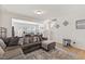 Inviting living room featuring a sectional sofa, neutral tones, and an open floor plan at 44 Bordeaux Dr, Clayton, NC 27527