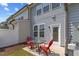 Cozy patio features a red table and chairs, perfect for outdoor relaxation at 44 Bordeaux Dr, Clayton, NC 27527