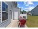 Inviting patio area with outdoor seating, offering a relaxing space with yard views at 44 Bordeaux Dr, Clayton, NC 27527