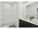 Bright bathroom with a large bathtub and sleek vanity with double sinks and modern fixtures at 4502 Mint Leaf Lane Ln, Raleigh, NC 27612