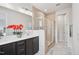 Luxurious bathroom with double vanity, tiled walk-in shower, and modern fixtures at 4502 Mint Leaf Ln, Raleigh, NC 27612