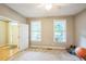 Cozy bedroom with carpet, natural light, and a doorway at 508 E Hatterleigh Ave, Hillsborough, NC 27278