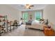 Bright bedroom with natural light, carpet, and a ceiling fan at 508 E Hatterleigh Ave, Hillsborough, NC 27278