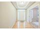 Bright entryway features hardwood floors, transom window, and door with sidelights at 508 E Hatterleigh Ave, Hillsborough, NC 27278