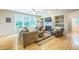 Inviting living room with hardwood floors, built-in shelves, and comfortable seating at 508 E Hatterleigh Ave, Hillsborough, NC 27278