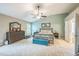 A spacious main bedroom features a ceiling fan, an ensuite entrance, and natural light from the window at 508 E Hatterleigh Ave, Hillsborough, NC 27278