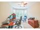Home office with large windows providing ample natural light and comfortable seating at 508 E Hatterleigh Ave, Hillsborough, NC 27278