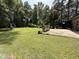 Expansive backyard featuring a well-maintained lawn and patio, ideal for outdoor living at 509 Forest Ridge Rd, Garner, NC 27529