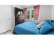 Bright bedroom with a large window, wood-look floors, and stylish curtains at 509 Forest Ridge Rd, Garner, NC 27529