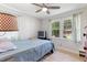 Comfortable bedroom with natural light from the double windows and modern ceiling fan at 509 Forest Ridge Rd, Garner, NC 27529