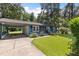 Charming single-story home with blue siding, a well-maintained lawn and an attached carport at 509 Forest Ridge Rd, Garner, NC 27529