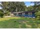 Inviting single-story home with a well-maintained lawn and a covered parking area at 509 Forest Ridge Rd, Garner, NC 27529