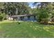 Charming single-story home with a lush, green front yard and manicured landscaping offers great curb appeal at 509 Forest Ridge Rd, Garner, NC 27529