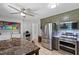 Bright eat-in kitchen with stainless steel appliances and laundry room at 509 Forest Ridge Rd, Garner, NC 27529