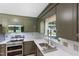 Well-lit kitchen featuring stainless steel appliances and light countertops at 509 Forest Ridge Rd, Garner, NC 27529