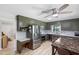 Updated kitchen with stainless steel appliances, gray-green cabinetry, and light countertops at 509 Forest Ridge Rd, Garner, NC 27529