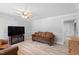 Cozy living room with neutral walls, wood-look flooring, and comfortable seating at 509 Forest Ridge Rd, Garner, NC 27529