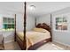 Comfortable bedroom with a four-poster bed and bright natural light at 509 Forest Ridge Rd, Garner, NC 27529