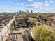 An aerial view of houses and street, with a city skyline in the distance at 517 Coleman St, Raleigh, NC 27610