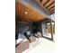 Covered patio with comfortable seating, wood ceiling, and an outdoor ceiling fan at 517 Coleman St, Raleigh, NC 27610