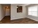 Dining room showcasing wood floors and a view into the kitchen area at 518 S Coalport Dr, Apex, NC 27502