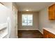 View of the kitchen area highlighting bright breakfast area and new wood style floors at 518 S Coalport Dr, Apex, NC 27502