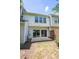 Private backyard with sliding doors and a cozy patio space perfect for outdoor relaxation at 5209 Echo Ridge Rd, Raleigh, NC 27612