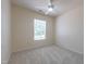 Bedroom with neutral walls, carpet flooring, a ceiling fan, and bright window at 5209 Echo Ridge Rd, Raleigh, NC 27612