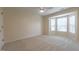 Bedroom featuring carpet flooring, a ceiling fan, and a bay window at 5209 Echo Ridge Rd, Raleigh, NC 27612
