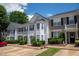 Attractive townhomes featuring coordinated exteriors, well-manicured landscaping, and convenient parking at 5209 Echo Ridge Rd, Raleigh, NC 27612