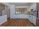 Well-lit kitchen with modern appliances, white cabinets, and a convenient pass-through to the living area at 5209 Echo Ridge Rd, Raleigh, NC 27612