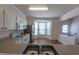 Spacious kitchen with white appliances, ample counter space, and a sunny bay window eating area at 5209 Echo Ridge Rd, Raleigh, NC 27612