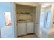 Laundry room featuring a washer and dryer, with wire shelving above at 5209 Echo Ridge Rd, Raleigh, NC 27612